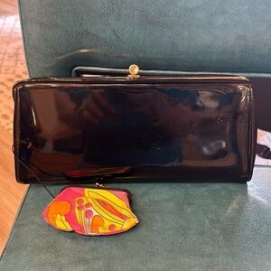 Paten clutch with attached colorful coin purse